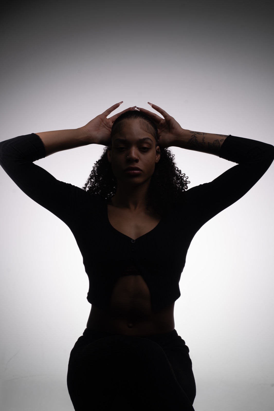 Studio — silhouette, arms raised
